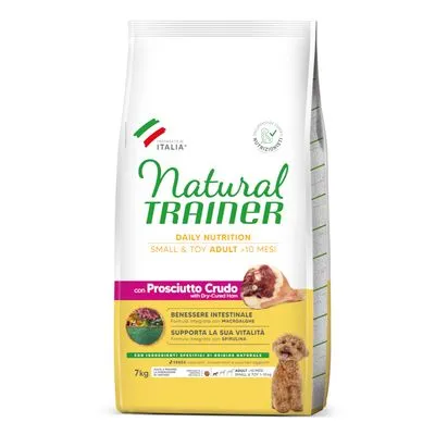 Zak Natural Trainer Daily Nutrition Small & Toy Adult +10 Mesi, met Prosciutto Crudo, 7 kg. Tekst: Benessere intestinale, supporta la sua vitalità. Afbeelding van kleine hond en ham.