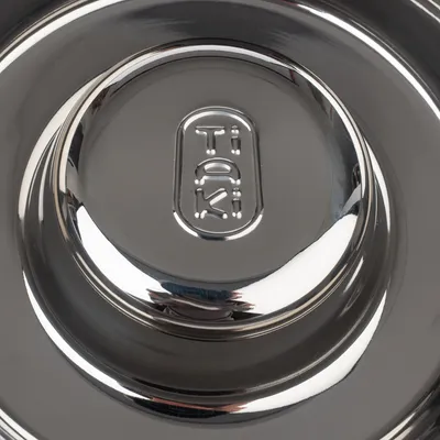 Stainless steel dog bowl with embossed 'Trixie' logo.