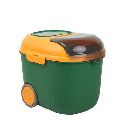Green feed container with yellow lid, transparent latch and two wheels for easy mobility.