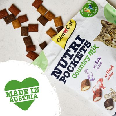 GimCat Nutri Pockets Country Mix kattegodbidder, synlige stykker i flere farver. Tekst på pakken: mit Ente with Duck, mit Rind with Beef. Grøn tekst: MADE IN AUSTRIA.