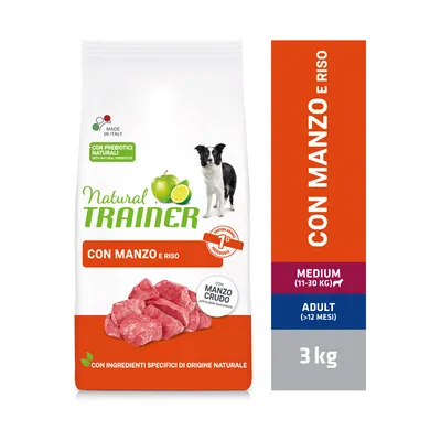 Natural Trainer Con Manzo e Riso, karma dla psów dorosłych średnich ras (11–30 kg), 3 kg. Z prebiotykami naturalnymi, wołowiną i ryżem. Widoczny pies, jabłko, limonka, kawałki mięsa.