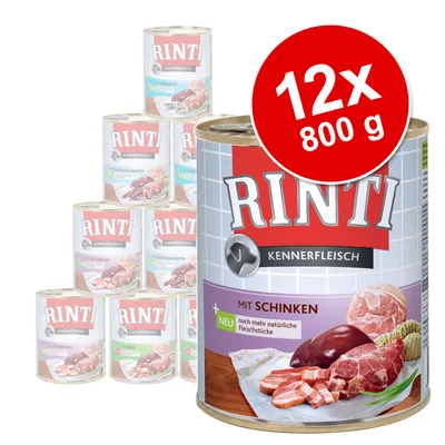 Pack de 12 latas de 800 g de comida para perros Rinti Kennerfleisch. Texto visible: 'Mit Schinken', 'Noch mehr natürliche Fleischstücke', 'NEU'. Imagen de carne en la etiqueta.