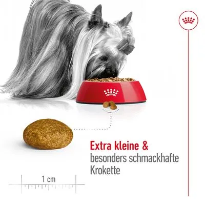 Extra kleine und besonders schmackhafte Krokette, Abbildung mit Maßstab von 1 cm. Hund frisst aus rotem Napf.