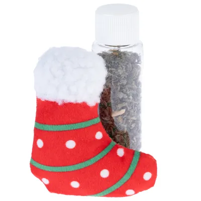 Rote Weihnachtsstrumpf-Spielzeug mit weissen Punkten und grünen Streifen, begleitet von einer transparenten Flasche mit getrocknetem Kraut.