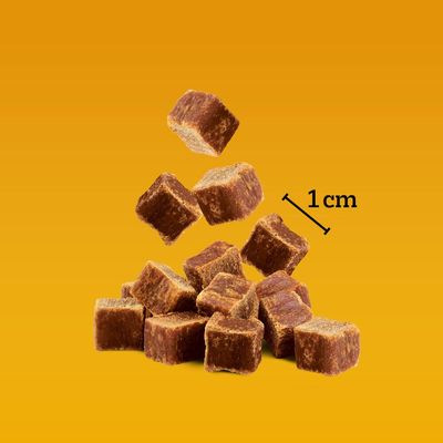Brown cube-shaped treats shown with a 1 cm size reference.