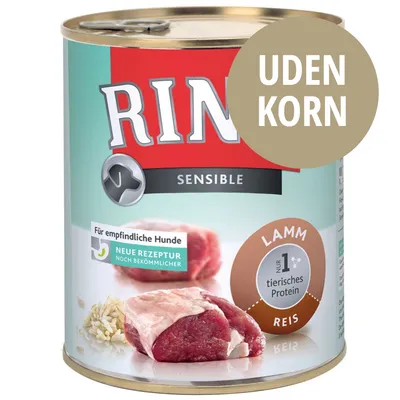 Rinti Sensible dåsefoder til hunde, synlig tekst: UDEN KORN, LAMM, REIS, Für empfindliche Hunde, Neue Rezeptur, Nur 1 tierisches Protein. Billede af kød og ris på emballagen.