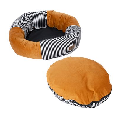 Rundes Haustierbett mit orangefarbenem Samtstoff und schwarz-weiss gestreiften Details, inklusive passendem abnehmbarem Kissen.