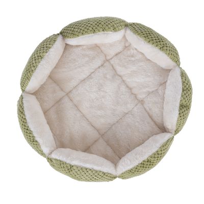 Letto per animali rotondo, verde, con imbottitura interna bianca morbida e superficie trapuntata.