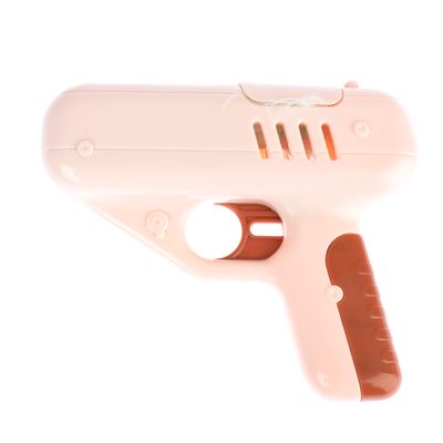 Pistolet en plastique beige et marron, poignée ergonomique visible, sans marque ni texte apparent.