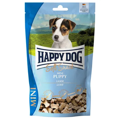 Confezione di snack per cani Happy Dog Soft Snack Mini Puppy Lamm Lamb, visibili piccoli snack a forma di osso. Testo: senza zuccheri aggiunti, ricetta priva di cereali.