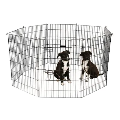 Schwarzes Metallgehege mit Gitterwänden, zwei schwarze Hunde sitzen darin. Gehege hat mehrere Verschlüsse und ist achteckig aufgebaut.