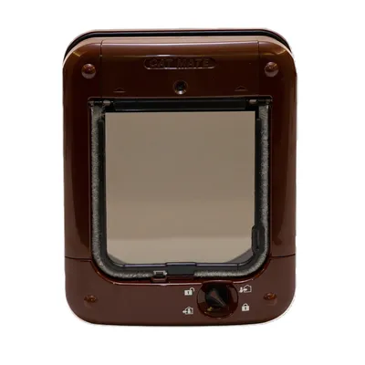 Brown cat flap by Cat Mate with rotary lock and symbols for different locking options.