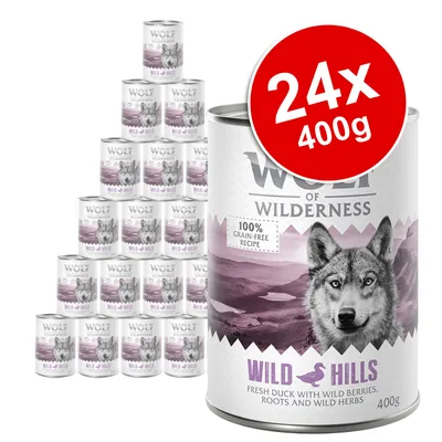 Wolf of Wilderness Wild Hills 24x400g tins, 100% grain-free recipe, fresh duck with wild berries, roots and wild herbs. Large red label shows pack size. Visible text only.