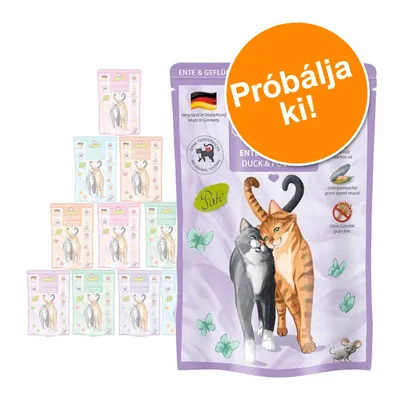 Macskaeledel csomagolás: két macska illusztráció, német zászló, 'Hergestellt in Deutschland', 'Ohne Tierversuche', 'Paté', 'Próbálja ki!' felirat narancssárga körben.