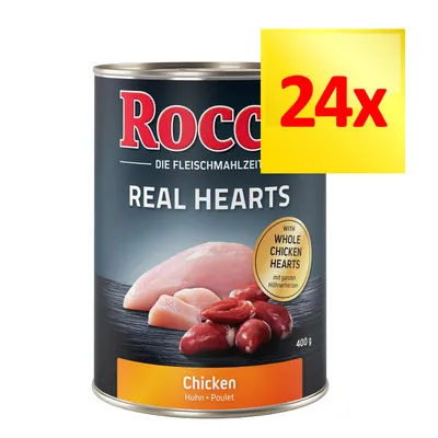 Rocco Real Hearts Chicken, puszka 400 g z widocznym napisem '24x'. Na etykiecie: całe serca kurczaka, zdjęcie mięsa. Produkt drobiowy dla zwierząt.