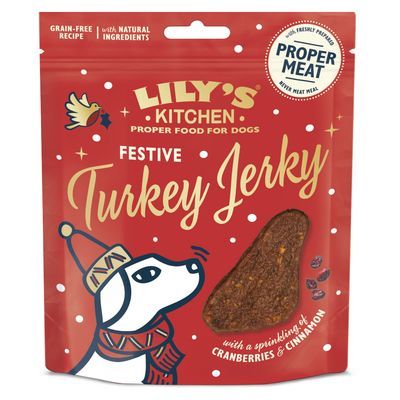 Lily's Kitchen Simply Glorious Chicken Jerky, 70g. Verpakking met twee stukjes kip-jerky en geïllustreerd hondendesign.