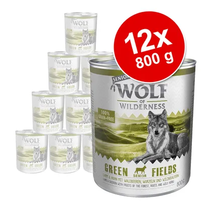 Pachet 12x800g conserve Wolf of Wilderness Senior Green Fields, text vizibil: 100% grain-free, imagine lup, etichetă Green Fields. Ambalaj metalic.