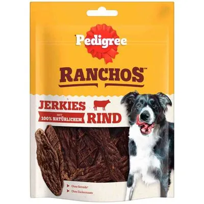 Pedigree Ranchos Jerkies Rind, met 100% natuurlijk rundvlees. Zonder granen, zonder toegevoegde suikers. Verpakking toont hond en gedroogde snacks.