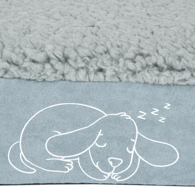 Cama para perro gris con superficie suave y una ilustración de un perro durmiendo con símbolos Zzz.