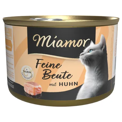 Boîte de nourriture pour chat Miamor Feine Beute mit Huhn, mention visible : +Taurin, sans céréales, image d’un chat et morceau de viande sur l’étiquette.