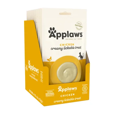 Box of Applaws chicken creamy lickable treat, 100% natural ingredients, certified B corporation, 10 x 15g packs visible on packaging.