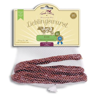 Упаковка Terra Canis Lieblingswurst Rind, 190 г, 8 штук. Видны колбаски в сетке, надписи: 100% Natur, luftgetrocknete Metzgerwurst, Improved recipe, My fave sausage (air-dried).