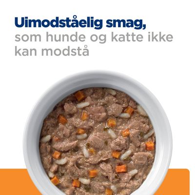 Uimodståelig smag, som hunde og katte ikke kan modstå. Skål med vådfoder, synlige kød- og grøntsagsstykker.