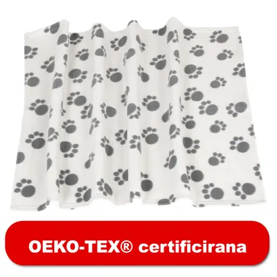 Bela odeja s sivimi odtisi tačk, spodaj rdeč napis: OEKO-TEX® certificirana.