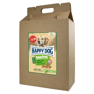 Förpackning med Happy Dog NaturCroq Lamm & Reis Knochen. Bild på hund, text: Dental Care, OHNE tillsatt socker, naturliga ingredienser. Kartong med bärhandtag. Förpackning med Happy Dog NaturCroq Lamm & Reis Knochen. Bild på hund, text: Dental Care, OHNE tillsatt socker, naturliga ingredienser. Kartong med bärhandtag.