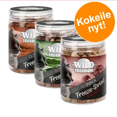 Kolme Wild Freedom Freeze-Dried -kissanherkkupurkkia eri makuina, etiketissä teksti '100% pure snack'. Oranssi ympyrä: Kokeile nyt!