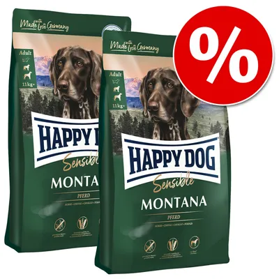 Два пакета кучешка храна Happy Dog Sensible Montana 11 кг+, надпис Adult, изображение на куче, голям червен символ за процент отстъпка.