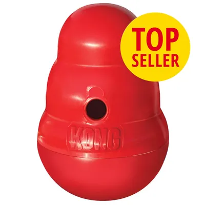 Rødt KONG-legetøj i plast med hul, præget tekst 'KONG' og gul cirkel med rød tekst 'TOP SELLER'. Rødt KONG-legetøj i plast med hul, præget tekst 'KONG' og gul cirkel med rød tekst 'TOP SELLER'.