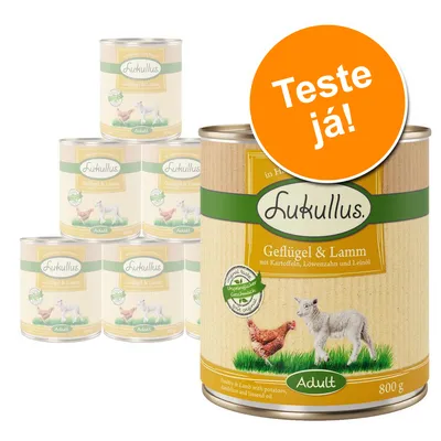 Lukullus Geflügel & Lamm Adult, lata de 800 g. Texto visível: 'Teste já!'. Imagem mostra várias latas empilhadas com rótulo em alemão e ilustração de frango e cordeiro.
