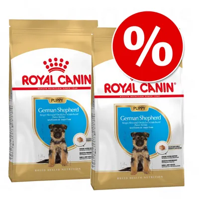 Två påsar Royal Canin Puppy German Shepherd hundfoder med stor röd procent-symbol för rabatt. Synlig text: 'ROYAL CANIN', 'PUPPY', 'German Shepherd'. Två påsar Royal Canin Puppy German Shepherd hundfoder med stor röd procent-symbol för rabatt. Synlig text: 'ROYAL CANIN', 'PUPPY', 'German Shepherd'.