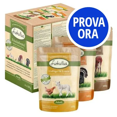 Confezione e buste Lukullus, visibili vari gusti tra cui Geflügel & Lamm, Wild, Gans. Etichetta blu con testo: PROVA ORA.