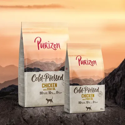 Purizon Cold-Pressed Chicken with Fish Oil. 90% tierische Zutaten, 10% Gemüse, 0% Getreide. Verpackung in zwei Grössen: 12kg und 400g.