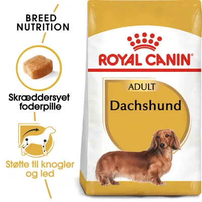 Royal Canin ADULT Dachshund tørfoderpose med billede af gravhund, tekst: 'Skræddersyet foderpille', 'Støtte til knogler og led', 'BREED NUTRITION' samt foderpille vist.