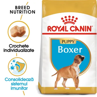 Royal Canin Puppy Boxer, croșete individualizate, consolidează sistemul imunitar. Ambalaj cu imagine cățel Boxer și text vizibil: BREED NUTRITION, Crochete individualizate.