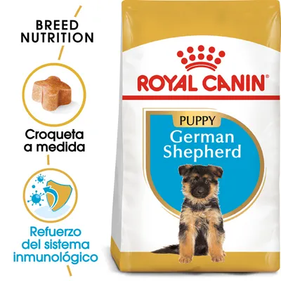 Saco de Royal Canin Puppy German Shepherd. Texto visible: 'Croqueta a medida', 'Refuerzo del sistema inmunológico', 'Breed Nutrition'. Imagen de croqueta y cachorro pastor alemán.