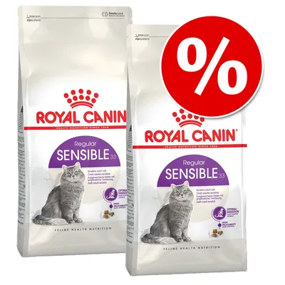 2 sacos de pienso para gatos Royal Canin Regular Sensible 33 con imagen de gato y símbolo de porcentaje en rojo, texto visible: Optimal Digestion, High Palatability.