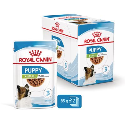 Royal Canin Puppy X-Small 2–10 months, 3 Stage, 85 g x12 annospussia. Pakkauksessa koiran kuva ja tuotetiedot näkyvissä.