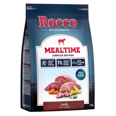 Rocco Mealtime Complete hondenvoer, lam. Graanvrij recept, 70% dierlijke ingrediënten, rijk aan vers lam. Volle smaak. Verpakking toont vlees en groenten. Gewicht: 1 kg.