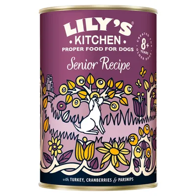 Lily's Kitchen Proper Food for Dogs Senior Recipe, created for older dogs 8+ years, with turkey, cranberries & parsnips. Purple tin with illustrated dog and flowers.