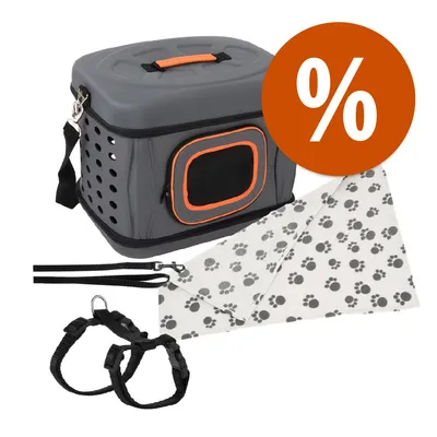 Set trasportino grigio con manico arancione, guinzaglio e pettorina neri, coperta bianca con impronte nere, simbolo percentuale per offerta visibile.