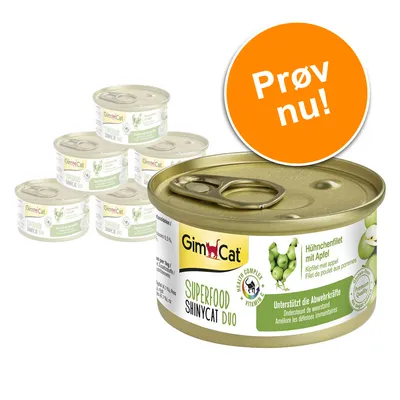 GimCat SUPERFOOD SHINYCAT DUO dåsemad, Hähnchenfilet mit Apfel, synlig tekst: 'Unterstützt die Abwehrkräfte', seks dåser, orange cirkel med teksten 'Prøv nu!'. GimCat SUPERFOOD SHINYCAT DUO dåsemad, Hähnchenfilet mit Apfel, synlig tekst: 'Unterstützt die Abwehrkräfte', seks dåser, orange cirkel med teksten 'Prøv nu!'.