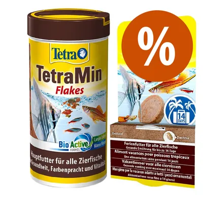 Confezione TetraMin Flakes BioActive per pesci ornamentali, testo visibile: Hauptfutter für alle Zierfische. A destra, confezione con simbolo % e scritta 14 days, alimentazione vacanze. Confezione TetraMin Flakes BioActive per pesci ornamentali, testo visibile: Hauptfutter für alle Zierfische. A destra, confezione con simbolo % e scritta 14 days, alimentazione vacanze.