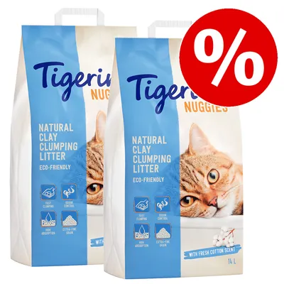 Два пакета Tigerino Nuggies Natural Clay Clumping Litter, 14 л, с изображение на котка и голям червен символ за процент. Видим текст: eco-friendly, fast clumping, odour control, high absorption.