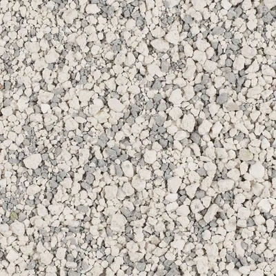 Close-up of white and grey granules, showing the texture and composition of a granular pet product such as litter or absorbent material.