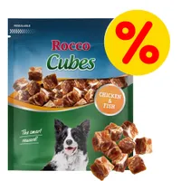 Rocco Cubes, snack per cani con pollo e pesce. Scritta 'CHICKEN & FISH' sulla confezione, simbolo percentuale giallo-rosso in alto a destra.