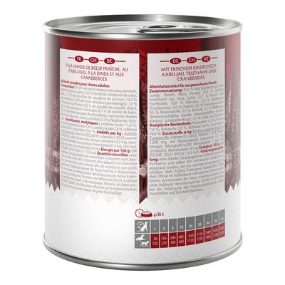 Boîte de nourriture pour chiens adultes, à la viande de bœuf fraîche, cabillaud, dinde et canneberges. Tableau de ration journalière visible selon le poids du chien. Texte en français et allemand.